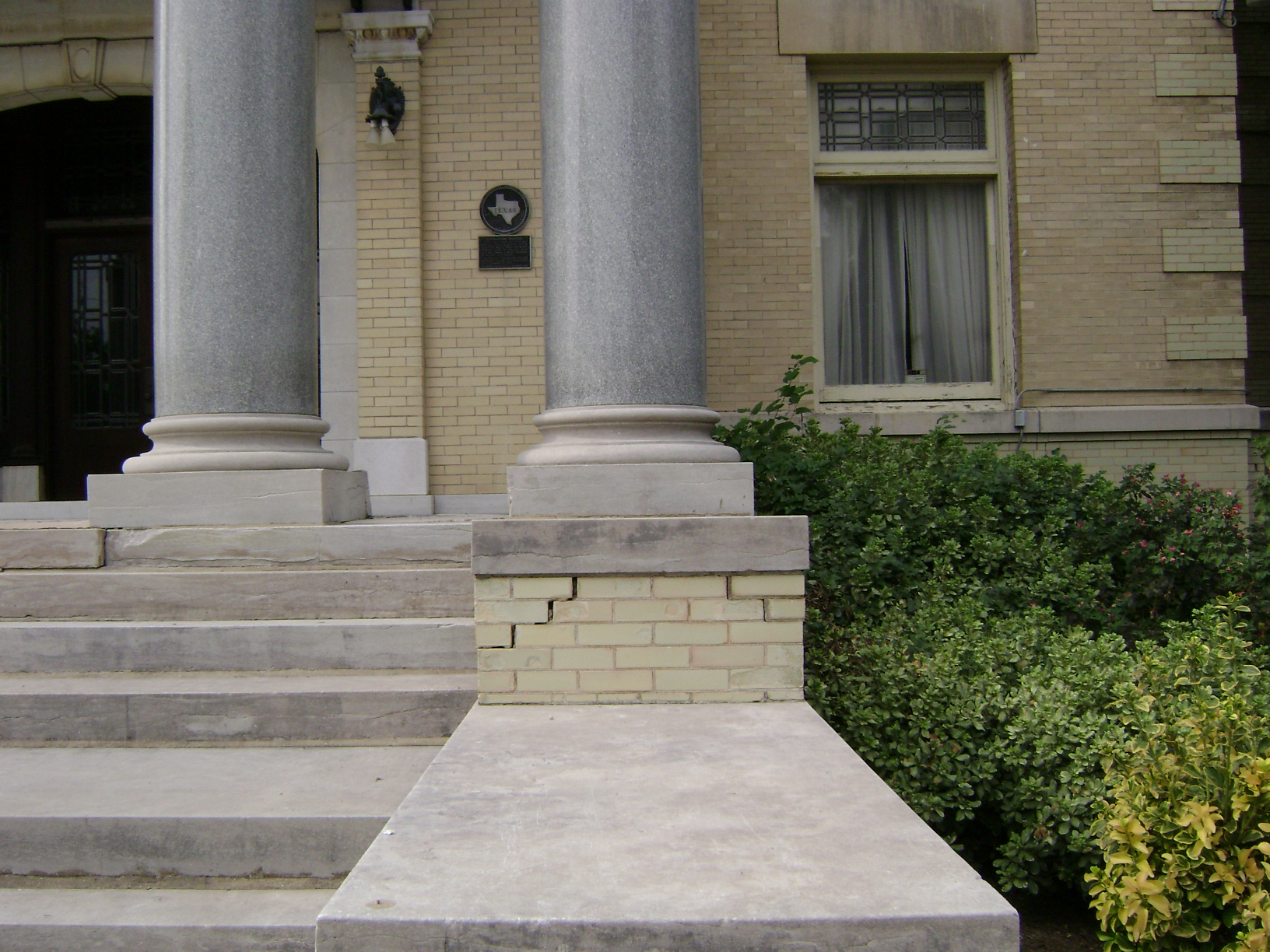 Alexander Mansion exterior front porch steps and column base Alexander Mansion exterior front porch steps and column base
