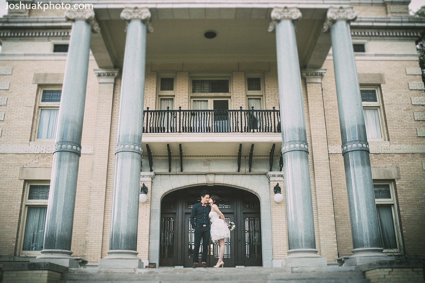 Couple on the front porch Alexander Mansion wedding by JoshuaK Photography